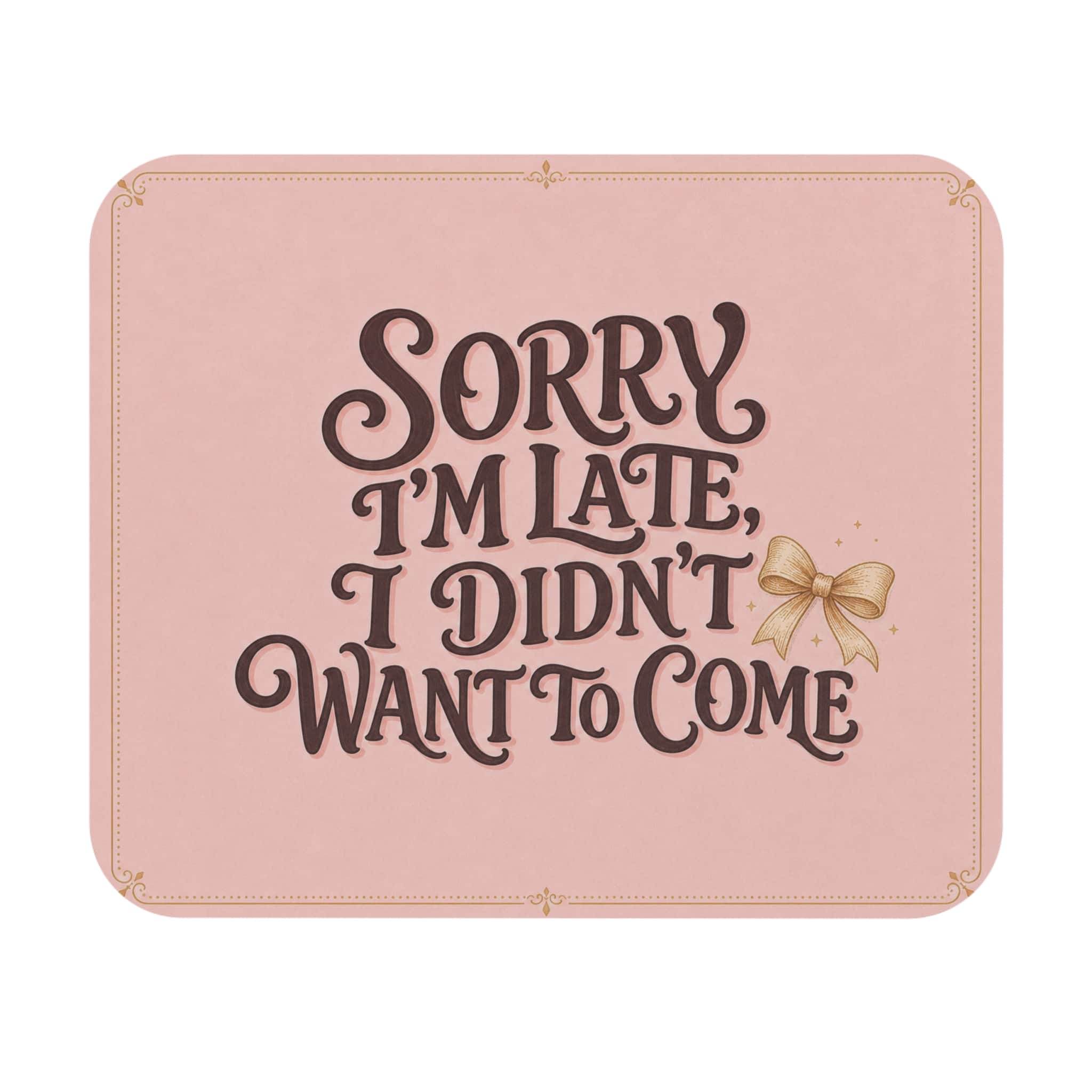 Sorry I'm Late, I Didn't Want to Come mouse pad with brown retro lettering on pink, shown on a white background