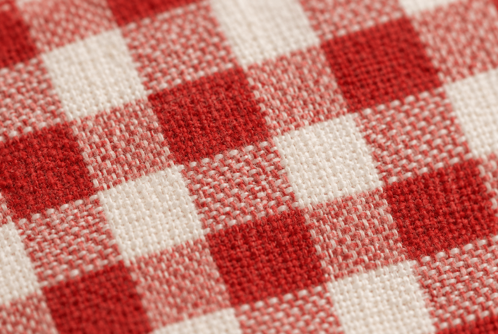 What Is a Gingham Print Meaning, History, and How to Style It 1 Close-up of a classic gingham checkerboard weave pattern